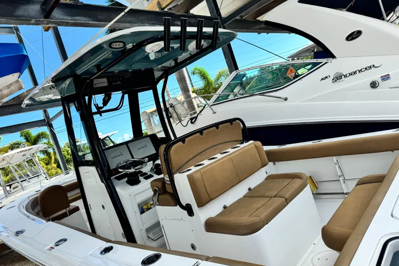 Slide: The Image of 2020 Sea Hunt Gamefish 27 Forward Seating boat with tan upholstery and modern controls. - 7