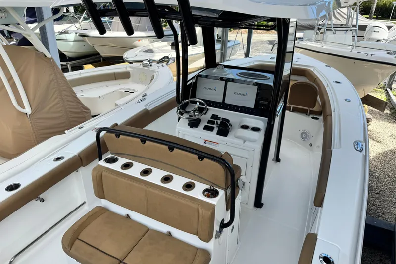 Slide: The Image of 2020 Sea Hunt Gamefish 27 boat with forward seating and modern navigation equipment. - 8