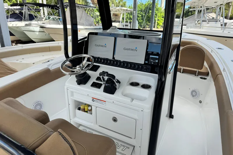 Slide: The Image of 2020 Sea Hunt Gamefish 27 boat interior with Garmin navigation system and forward seating. - 9