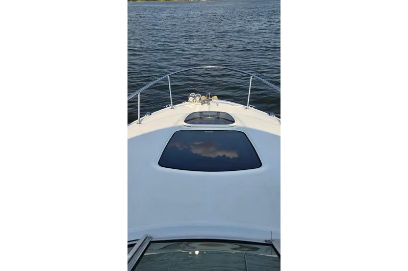 Slide: The Image of 2009 Sea Ray 270 Sundancer boat on calm water, view from the deck. - 9
