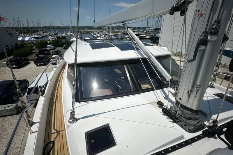 Slide: The Image of 2019 Moody 54 DS yacht docked at marina, showcasing sleek design and modern features. - 12