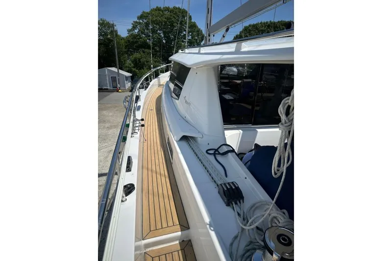 Slide: The Image of Sleek 2019 Moody 54 DS yacht deck with teak flooring and rigging. - 17