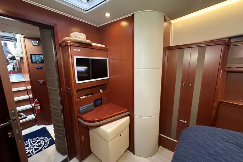 Slide: The Image of Luxurious interior of 2019 Moody 54 DS yacht with wood paneling and modern amenities. - 28