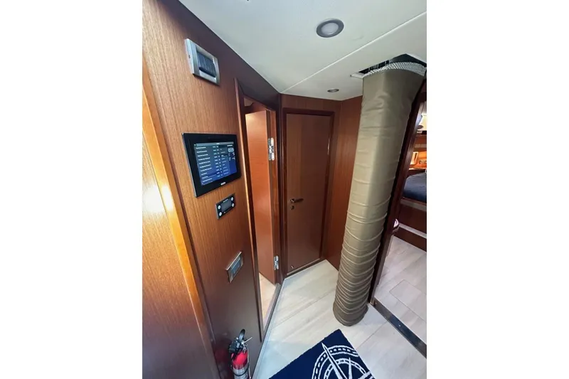 Slide: The Image of Interior of 2019 Moody 54 DS yacht with control panel and wooden finish. - 32