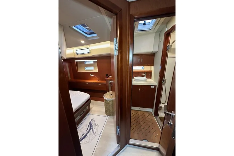 Slide: The Image of Luxurious interior of 2019 Moody 54 DS yacht with bedroom and bathroom. - 33