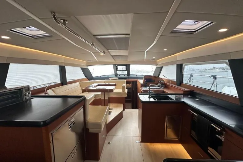 Slide: The Image of Luxurious interior of 2019 Moody 54 DS yacht with modern kitchen and seating area. - 40