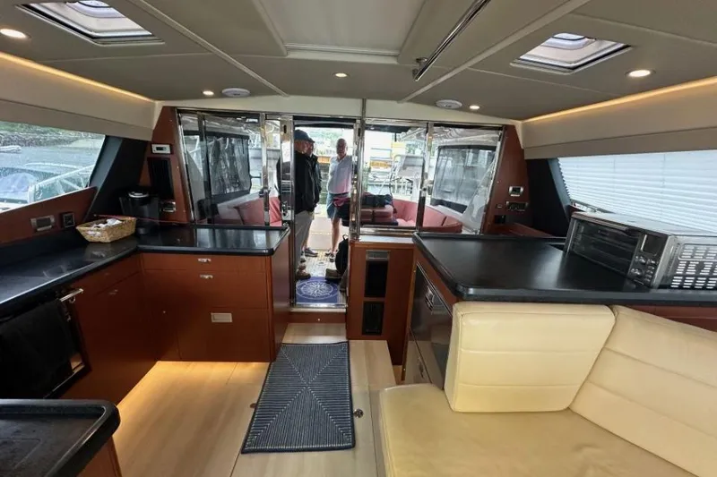 Slide: The Image of Interior of 2019 Moody 54 DS yacht with modern kitchen and seating area. - 43