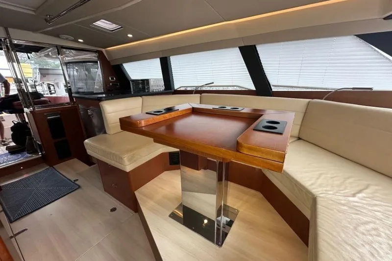 Slide: The Image of Luxurious interior of 2019 Moody 54 DS yacht with elegant seating and wooden table. - 45