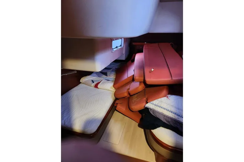 Slide: The Image of Cozy cabin interior of 2019 Moody 54 DS yacht with beds and cushions. - 47