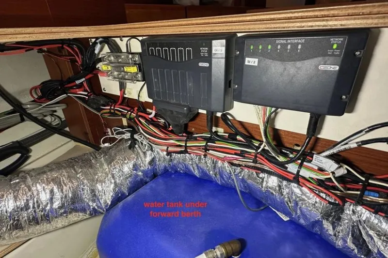 Slide: The Image of Electrical wiring and components above water tank in 2019 Moody 54 DS yacht. - 49