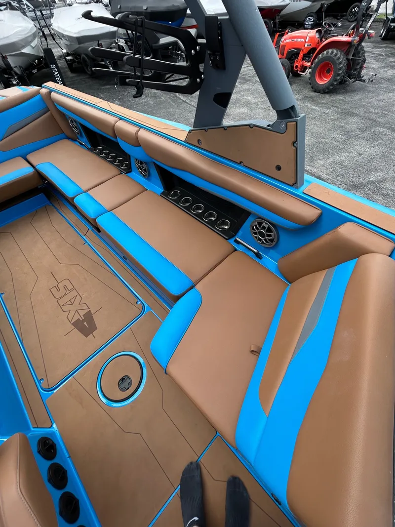 Slide: The Image of Interior of Axis T250 boat, brown and blue design, 2023 model. - 25