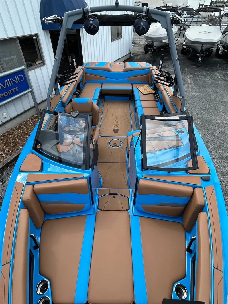 Slide: The Image of 2023 Axis T250 boat with blue and brown interior. - 8