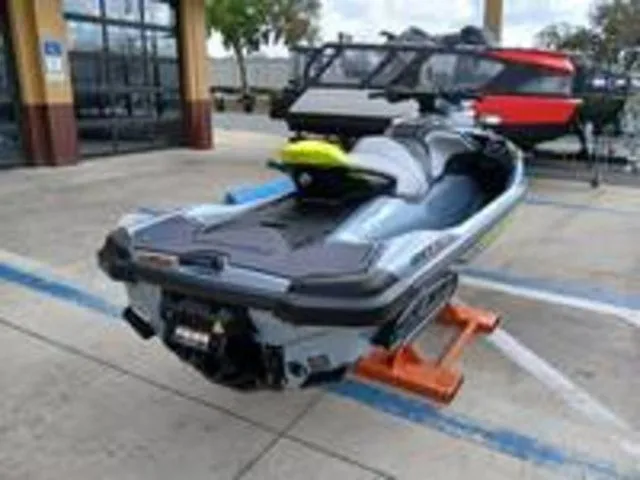 Slide: The Image of 2026 Sea-Doo RXT-X jet ski parked outdoors. - 11