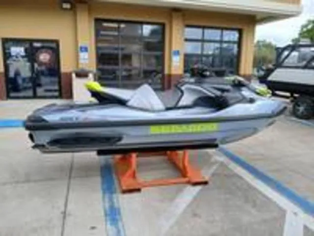 Slide: The Image of 2026 Sea-Doo RXT-X jet ski on a parking lot. - 13