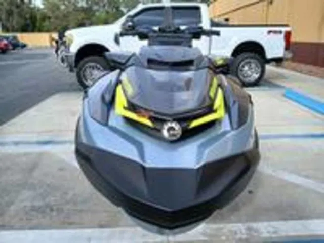 Slide: The Image of 2026 Sea-Doo RXT-X jet ski parked in front of white truck. - 4