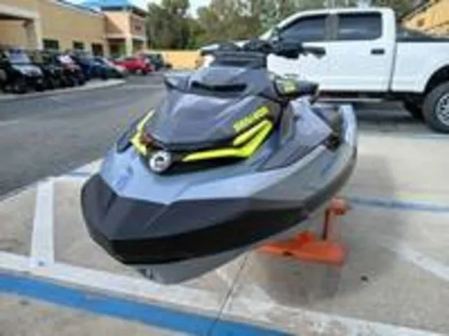 Slide: The Image of 2026 Sea-Doo RXT-X jet ski displayed in parking lot. - 5
