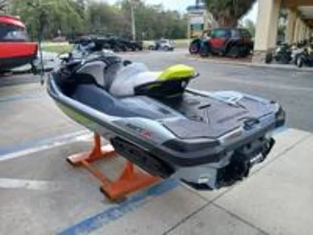 Slide: The Image of 2026 Sea-Doo RXT-X jet ski on a parking lot. - 8