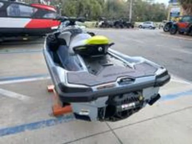 Slide: The Image of 2026 Sea-Doo RXT-X jet ski parked outdoors. - 9