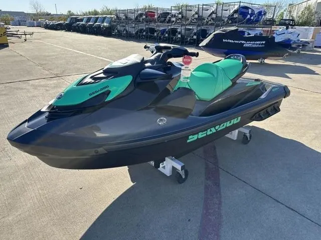 Slide: The Image of 2026 Sea-Doo GTI SE 130 jet ski displayed in a parking lot. - 4