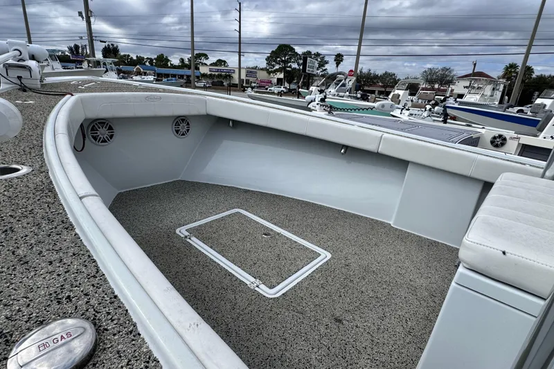 Slide: The Image of 2021 Pair Customs 24 Center Console MV boat interior with seating and storage. - 13