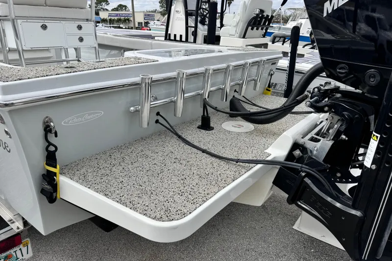 Slide: The Image of 2021 Pair Customs 24 Center Console MV boat with motor and rod holders. - 4