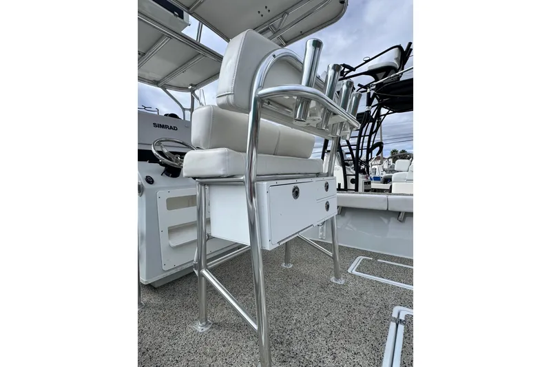 Slide: The Image of 2021 Pair Customs 24 Center Console MV boat interior with seating and storage. - 9