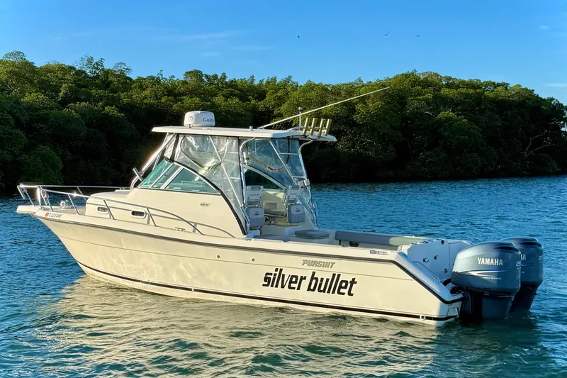 The Image of 2003 Pursuit 2870 Walkaround boat named "Silver Bullet" on water with Yamaha engines. - 0