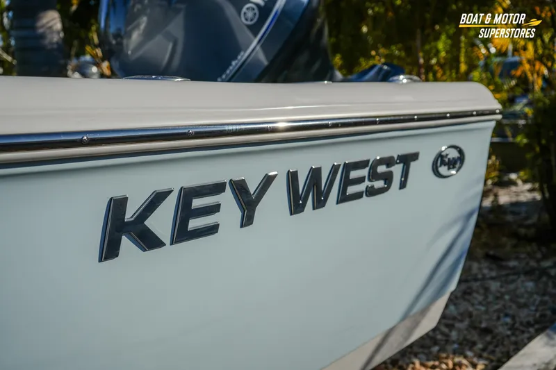 Slide: The Image of 2026 Key West 188 Bay Reef boat side view with logo, at Boat & Motor Superstores. - 14