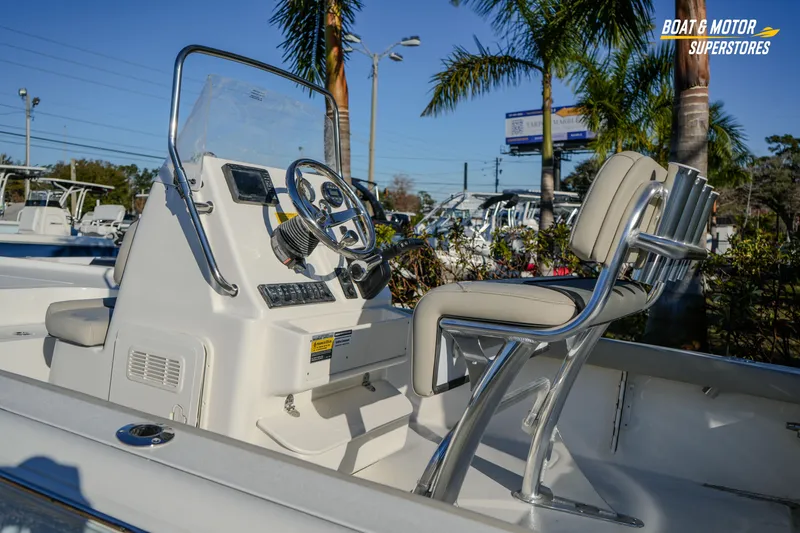Slide: The Image of 2026 Key West 188 Bay Reef boat interior with steering console and seating. - 16