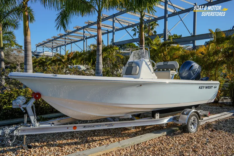 Slide: The Image of 2026 Key West 188 Bay Reef boat on trailer, surrounded by palm trees. - 3