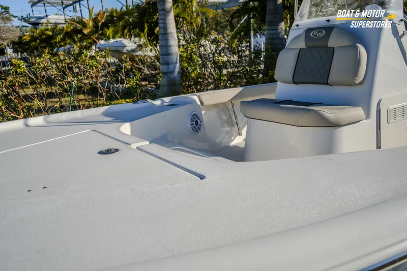 Slide: The Image of 2026 Key West 188 Bay Reef boat interior with seating and console, outdoor setting. - 7