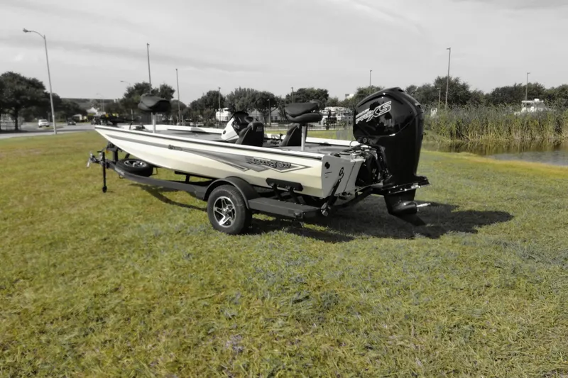 Slide: The Image of 2026 Ranger RT188 boat on trailer, parked on grass near a pond. - 4