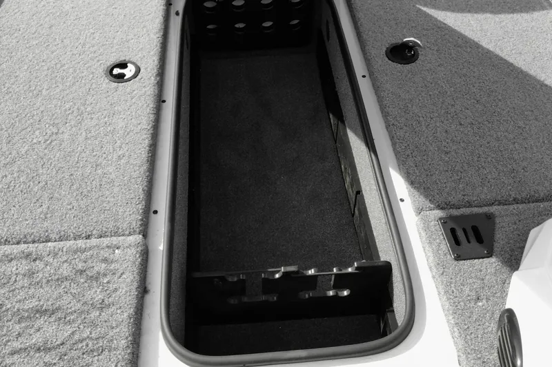 Slide: The Image of 2026 Ranger RT188 boat storage compartment with carpeted interior and secure latches. - 10