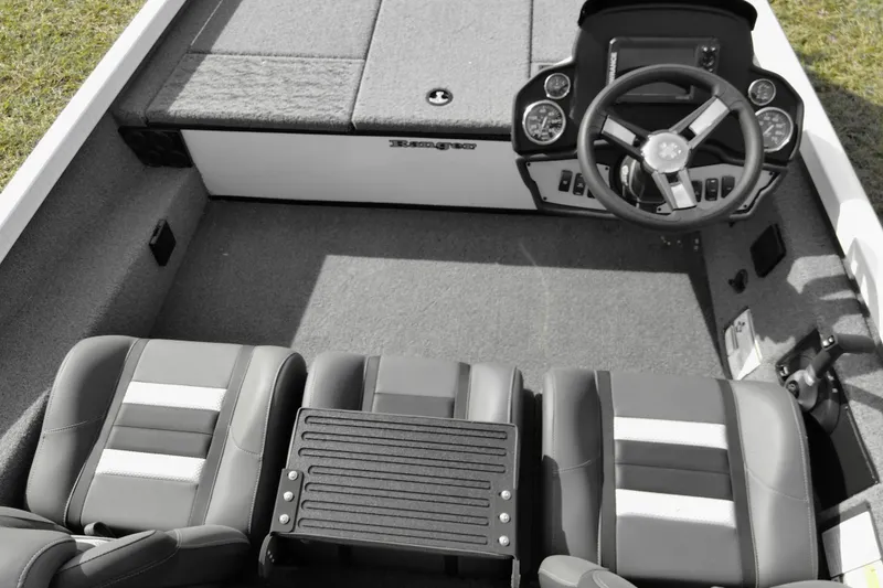 Slide: The Image of 2026 Ranger RT188 boat interior with steering wheel and seating, showcasing modern design. - 11