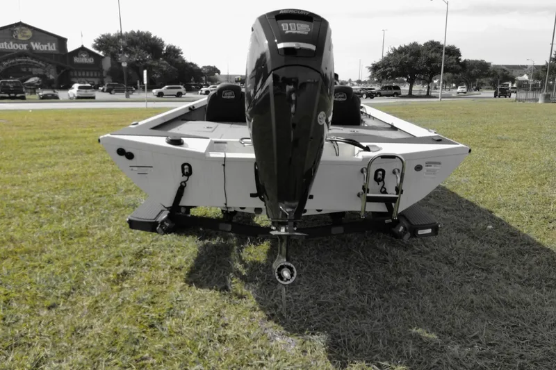 Slide: The Image of 2026 Ranger RT188 boat with outboard motor on grassy area near Outdoor World. - 5