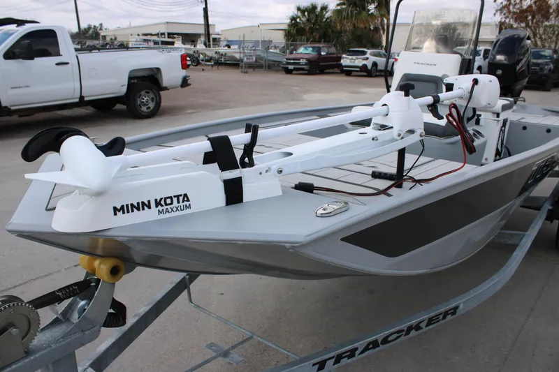 Slide: The Image of 2026 Tracker Bass Tracker Classic CC boat with Minn Kota Maxxum motor on trailer. - 15