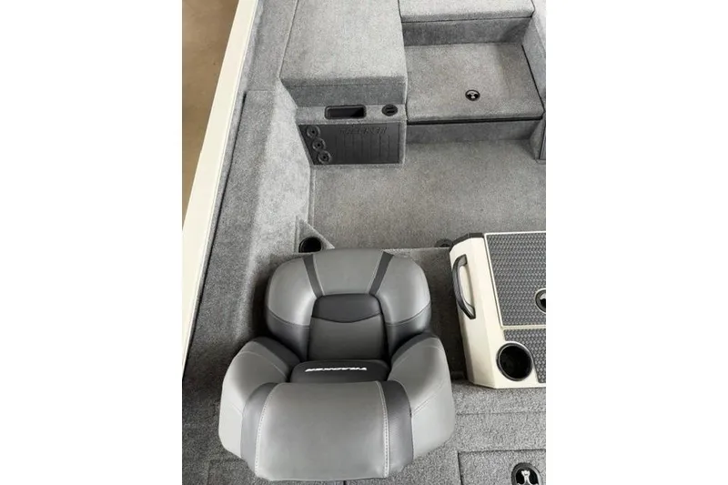 Slide: The Image of 2026 Tracker Savage 215 boat interior with gray seating and storage compartments. - 15
