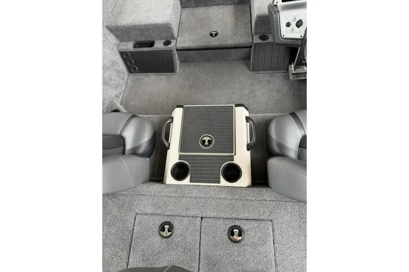 Slide: The Image of Interior of 2026 Tracker Savage 215 boat with seating and storage compartments. - 14