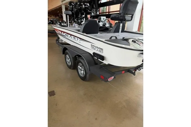 Slide: The Image of 2026 Tracker Savage 215 boat on trailer in showroom. - 3