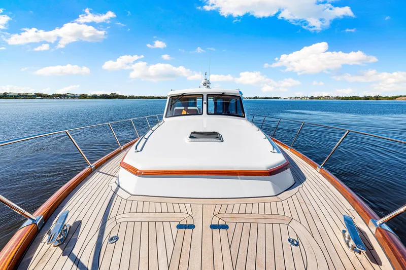 Slide: The Image of 2026 Vicem 55 Classic yacht on serene water under blue sky. - 3