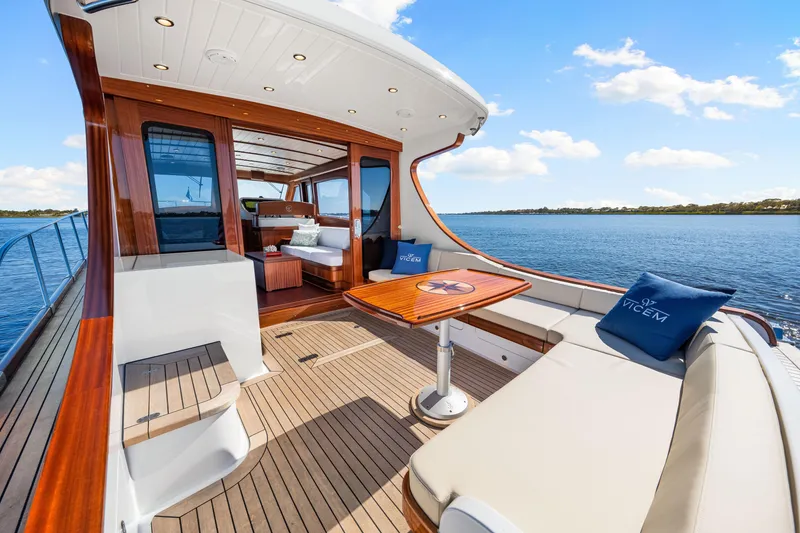 Slide: The Image of 2026 Vicem 55 Classic yacht with elegant teak deck and luxurious seating. - 4