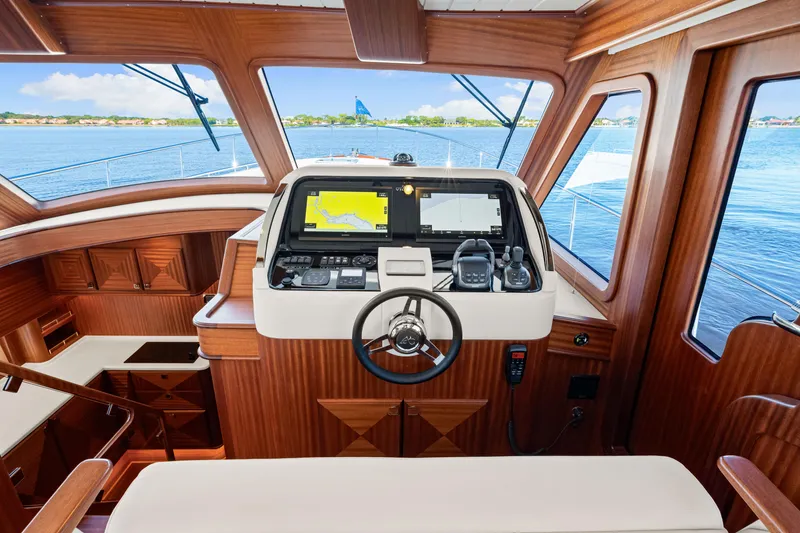 Slide: The Image of Pilothouse of 2026 Vicem 55 Classic yacht with modern navigation equipment and wooden interior. - 8