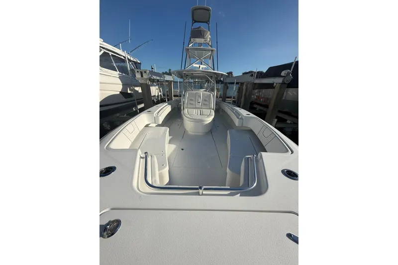 Slide: The Image of 2024 Contender 44 ST boat with sleek metal framework and modern design. - 2