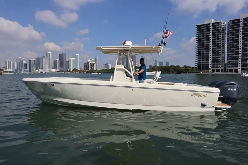 Slide: The Image of 2002 Intrepid 289 Open boat with city skyline. - 2