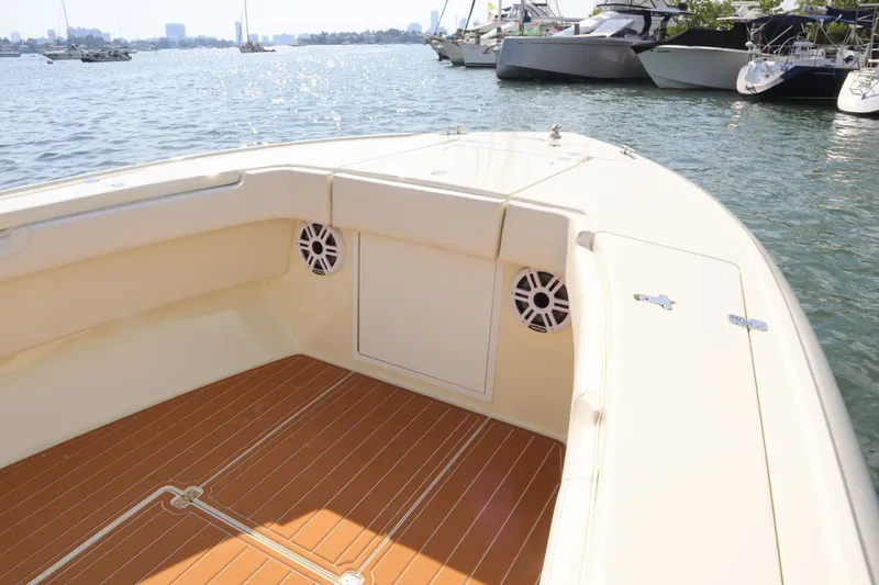 Slide: The Image of Intrepid 289 Open 2002 boat on calm water. - 22