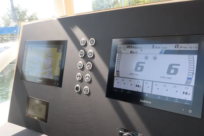 Slide: The Image of Intrepid 289 Open 2002 boat console with Garmin displays. - 27