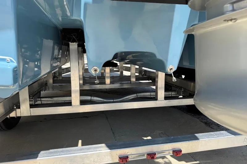 Slide: The Image of 2026 Shallow Sport 25 X3 boat on trailer, showcasing hull design and structure. - 15