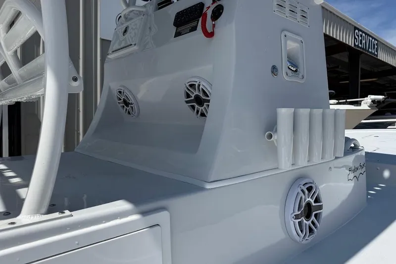 Slide: The Image of 2026 Shallow Sport 25 X3 boat console with speakers and rod holders. - 17