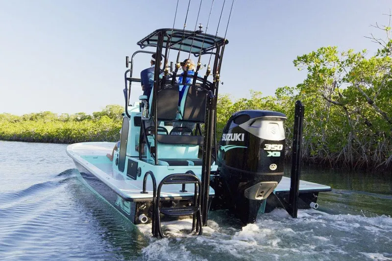 Slide: The Image of Manufacturer Provided Image: 2025 Shallow Sport 25 X3 boat with Suzuki 350 engine navigating through water. - 3