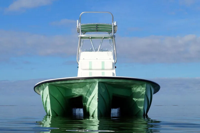 Slide: The Image of Manufacturer Provided Image: 2025 Shallow Sport 25 X3 boat on calm water, front view, clear sky background. - 6